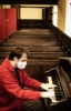 Felix playing the Bellows organ during a visit 2020